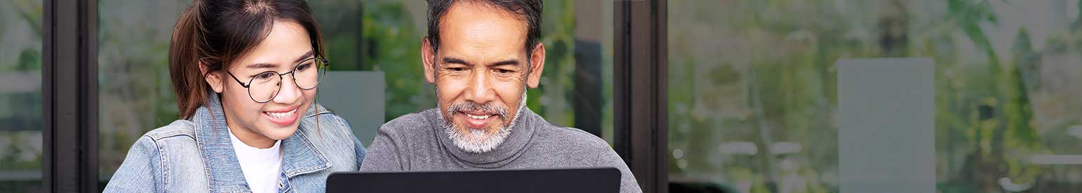 Two people at a computer